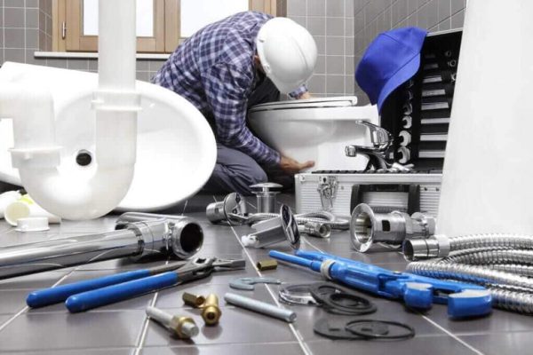 plumber-at-work-in-a-bathroom